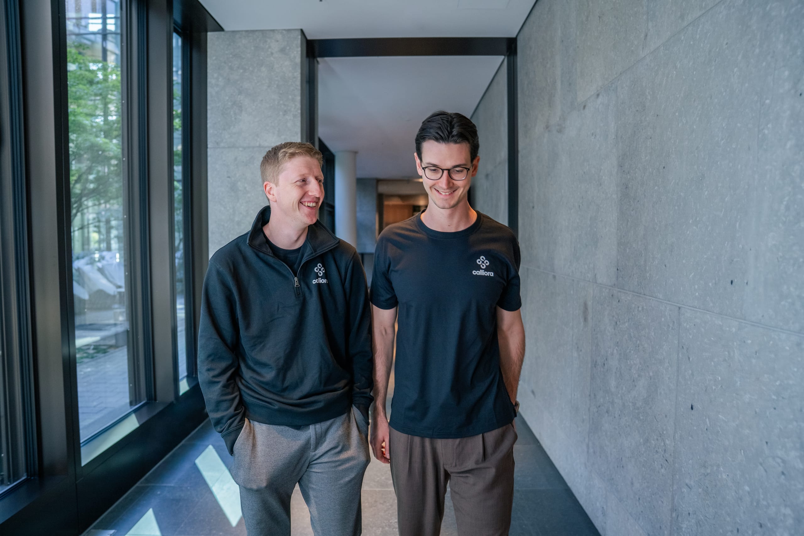 The calliora founders talking in a hallway